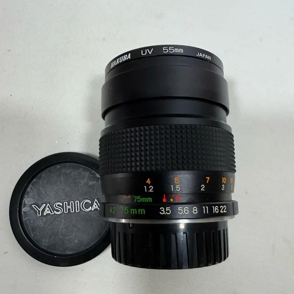 Yashica Zoom Lens 42- 75mm with case & Hakuba uv 55mm lens